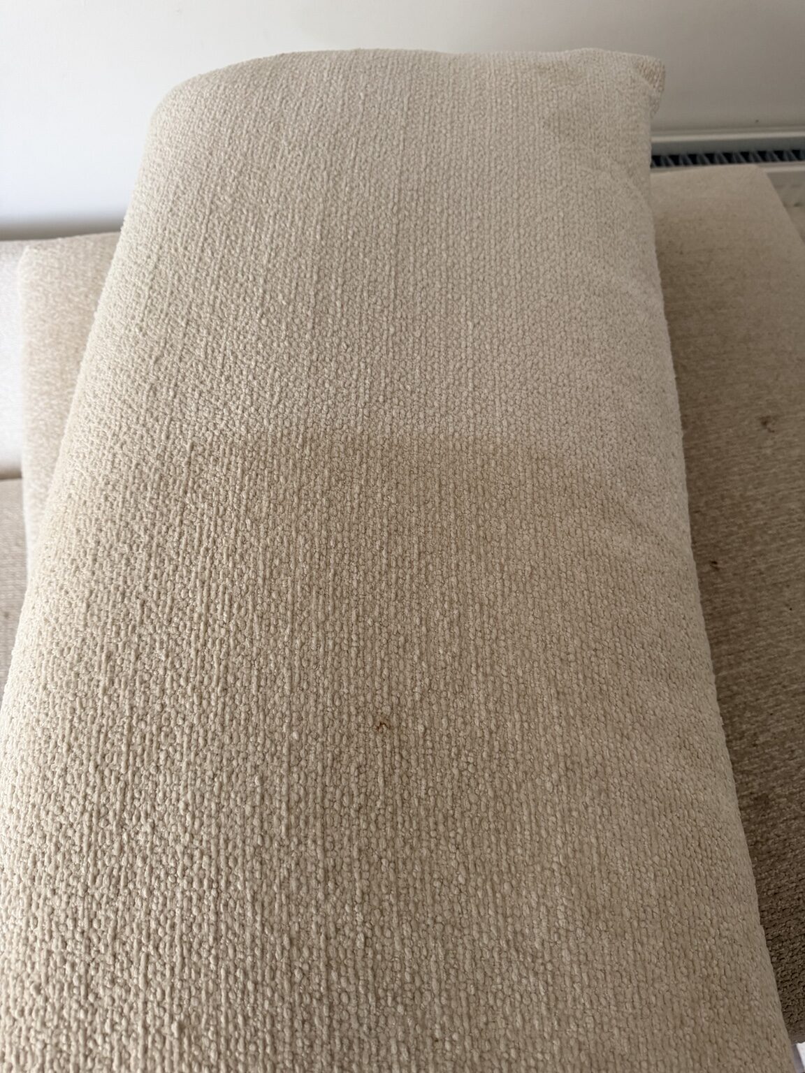 Soiling visible on a polyester bouclé sofa before professional cleaning in Edinburgh