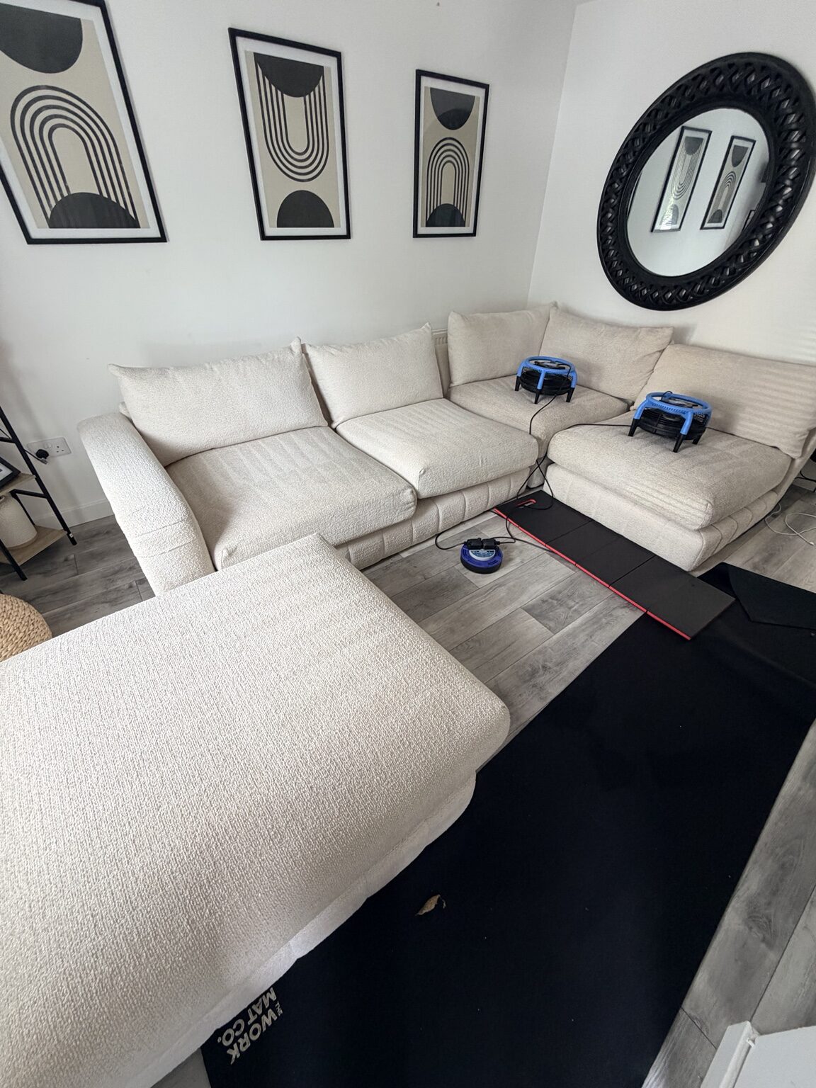 Professionally cleaned polyester bouclé corner sofa drying with air movers in Edinburgh