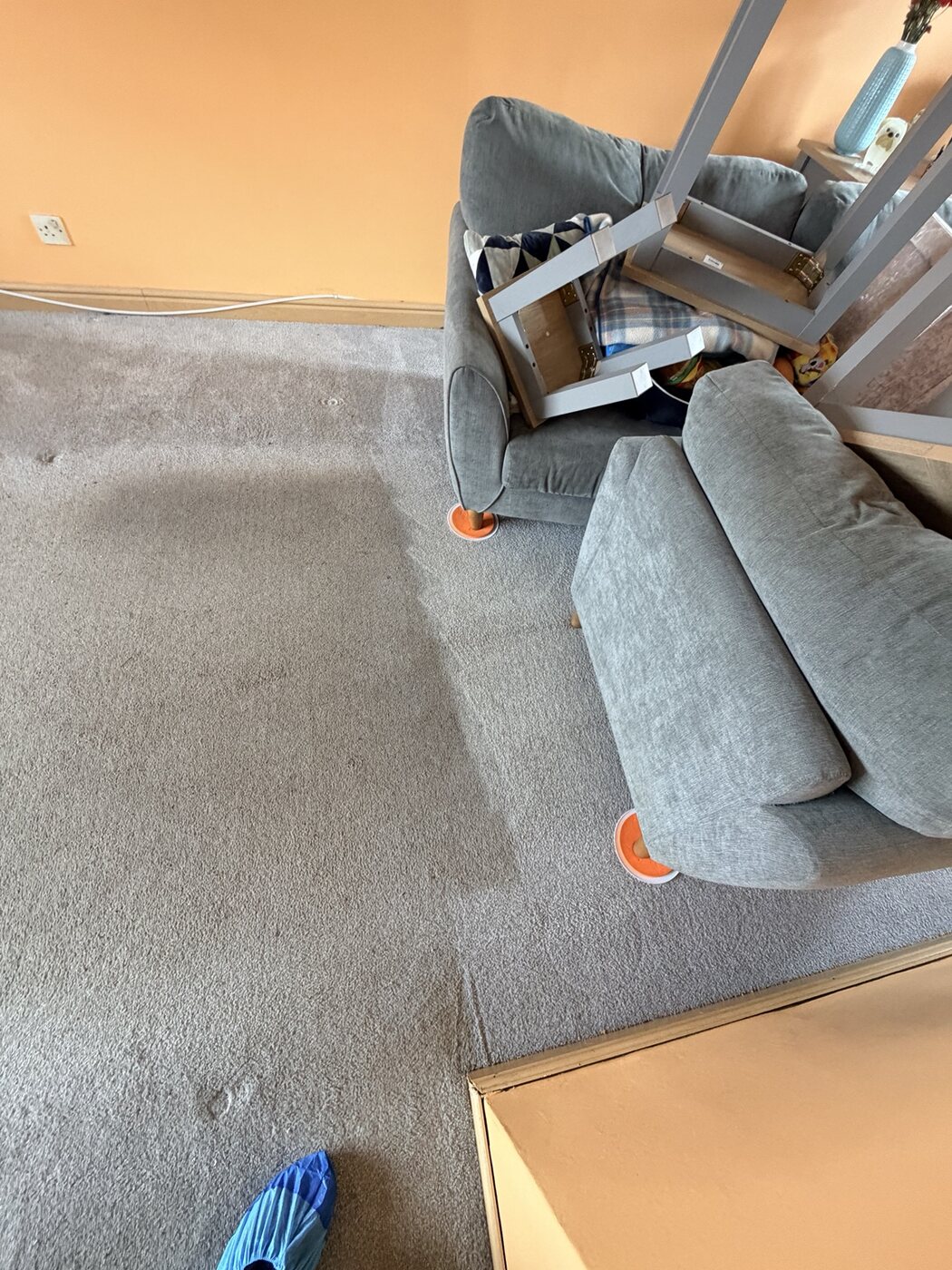 Polyester living-room carpet being professionally cleaned around furniture on protective glides in Armadale