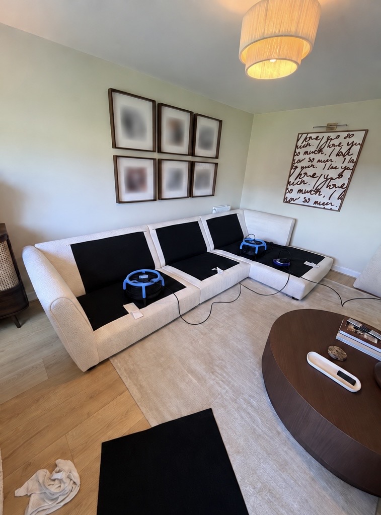 West Calder bouclé corner sofa during professional cleaning with drying equipment positioned on the upholstery