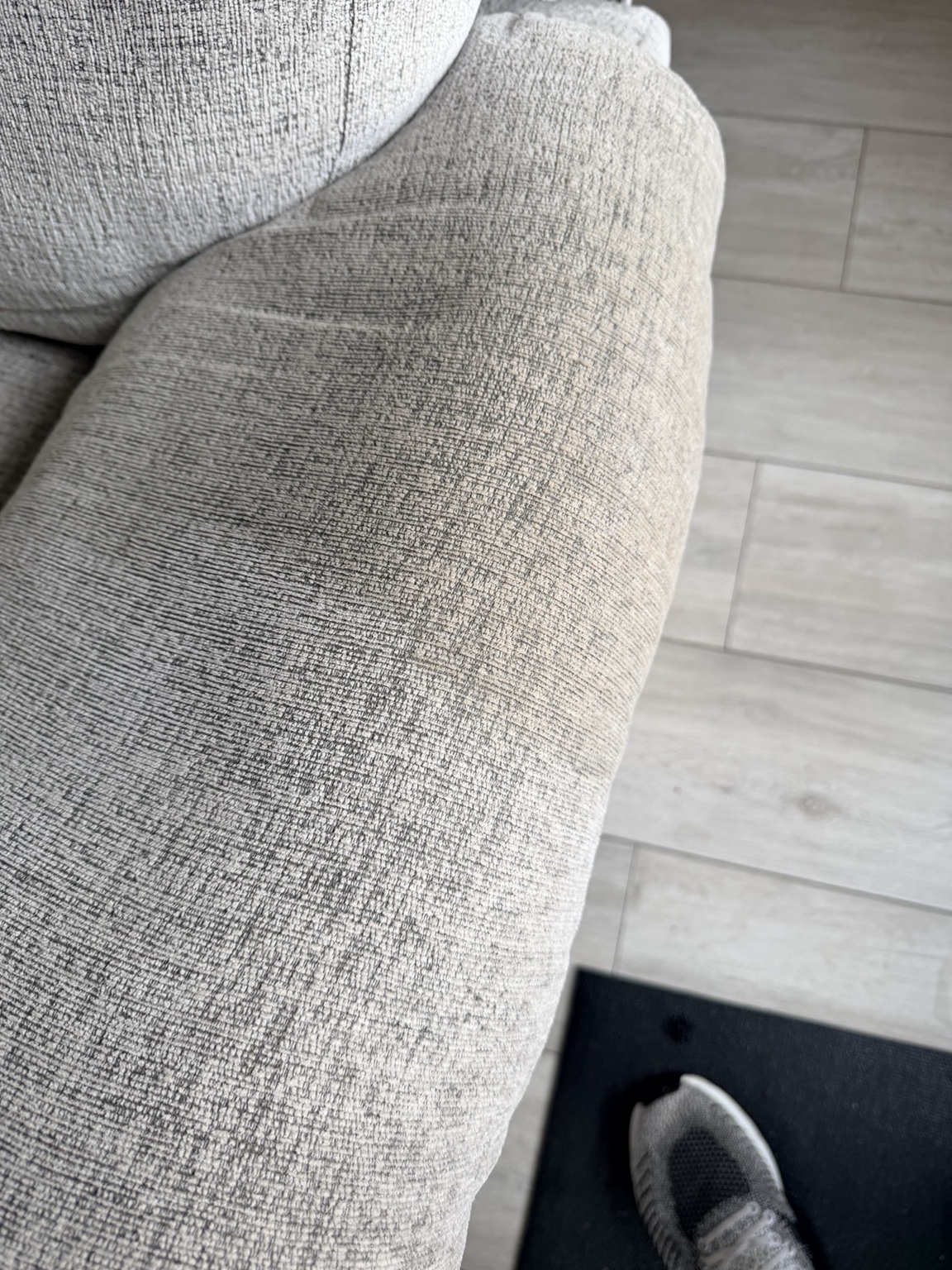 Close view of the cleaned light-coloured sofa fabric in Livingston